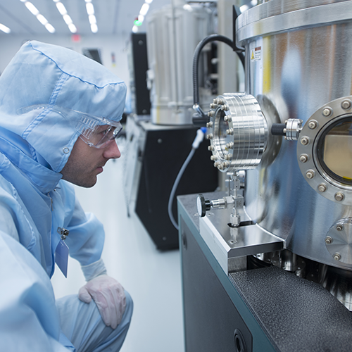 Scientist observing sample at the Minnesota Nano Center